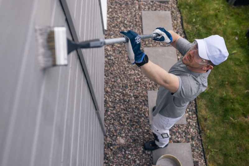 Painter painting a wall