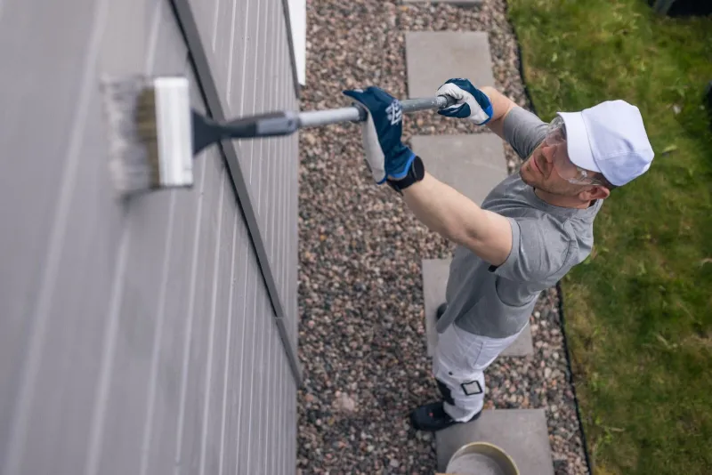 Painter painting a wall